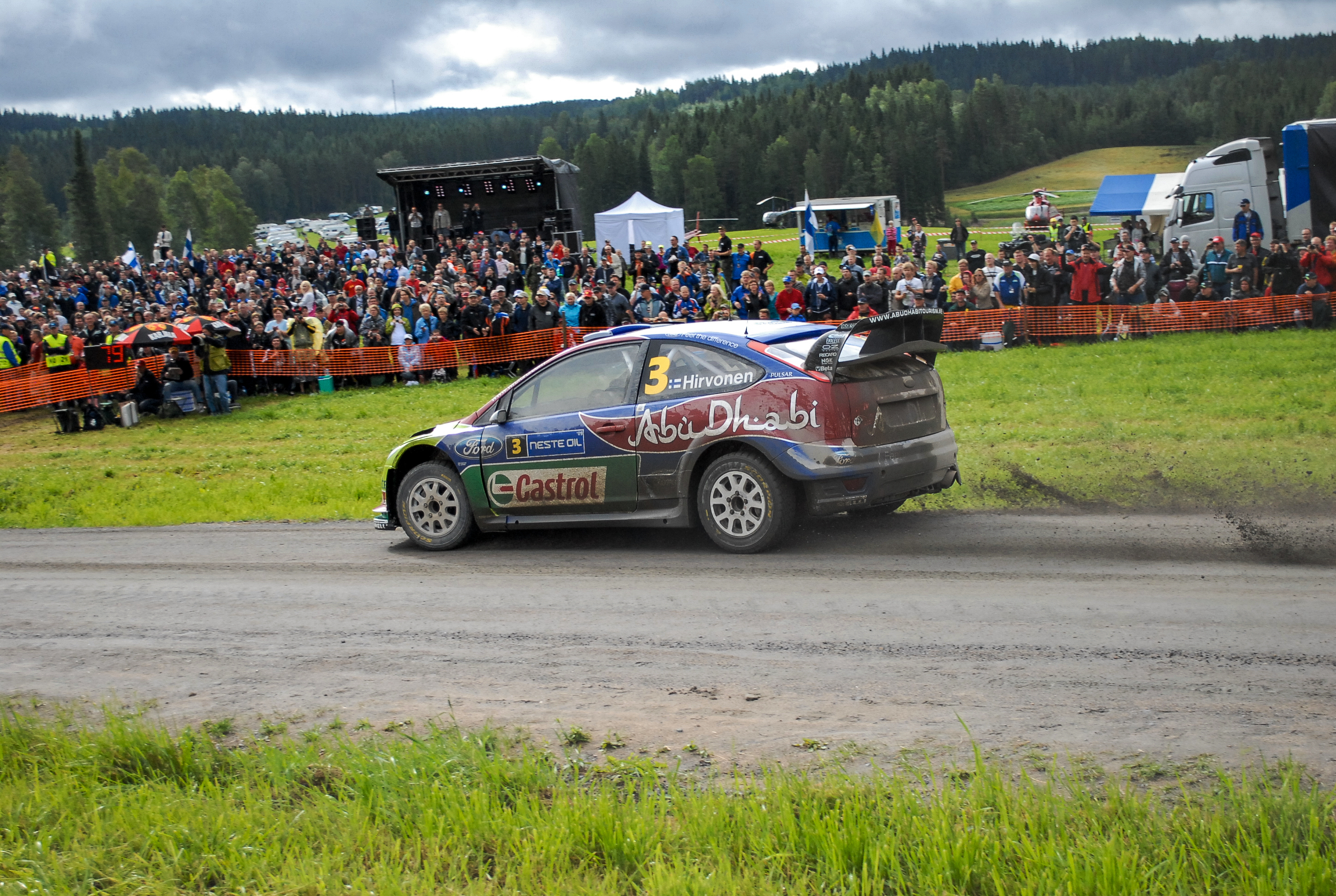 There were probably thousands of people at this spectator spot.  That is a concert stage in the background.  There was a jumbotron to the right where they would show the cars approach the corner. It was pretty amazing. (Finland 2009)<br />07/31/2009 @ 23:28<br />Camera: NIKON D200<br />Lens: AF-S DX VR Zoom-Nikkor 18-55mm f/3.5-5.6G