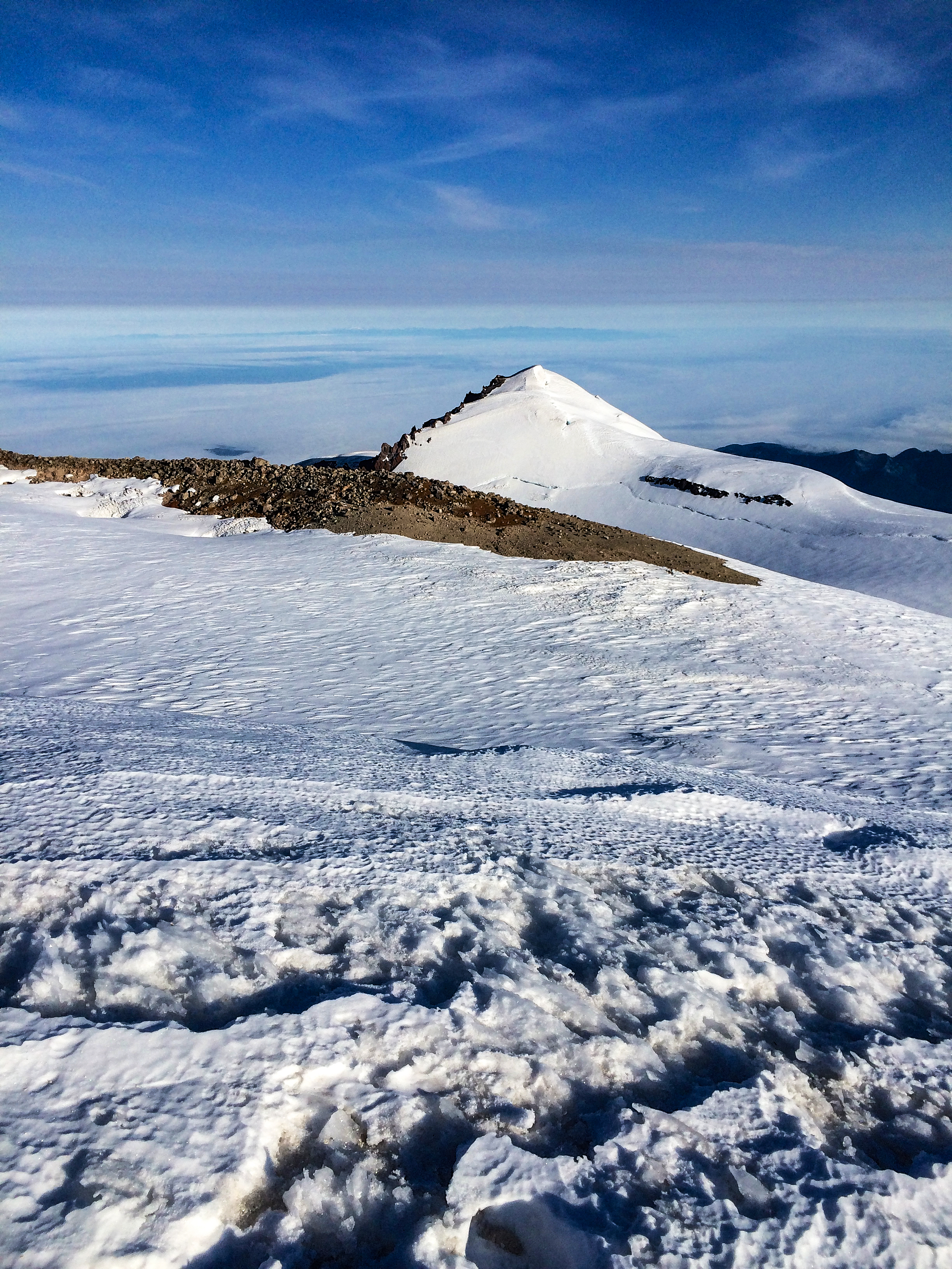 I started training for my first attempt at Mt. Rainier just before we learned my dad had terminal cancer.  Just over two years later I was able to carry a small vial of his ashes to the top of the tallest mountain in the state he loved and give him this view looking northwest over his kids and his wife and his mom. If there is an afterlife, I think that's the one he'd have wanted. For all of us, I hope we we'll have yet one more reminder of the huge part he played in all of our lives.<br />08/21/2014 @ 07:41<br />Camera: iPhone 5s<br />Lens: iPhone 5s back camera 4.12mm f/2.2