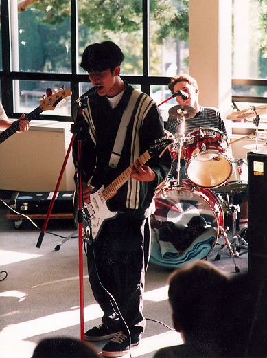 the band playing a show for their high school